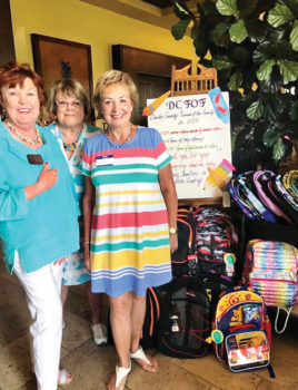 Community Relations Chair Nanci Odom presents Friends of the Family backpacks and school supplies from the Women’s Club 2019 drive.