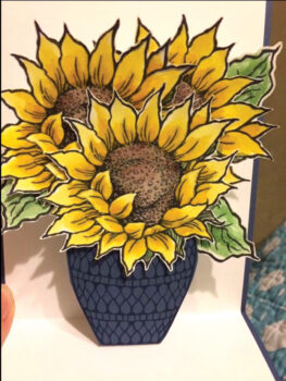 A sample of the bright, cheerful sunflower surprise pop-up cards made by the Sassy Stampers