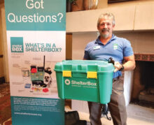 Brian Glenn shows a smaller version of the 40-gallon ShelterBox.