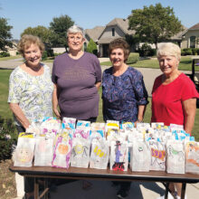 Filling the trick or treat bags (left to right): Eileen Whittaker, Marnita Torres, Darla Chupp, and Pat Hamblin