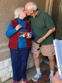 Klaus Dannenberg is giving his sweet wife Betty a loving kiss.