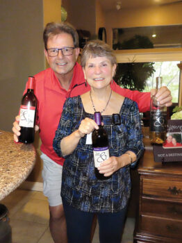 Wine Knot hosts, Vicki and Scott Baker, showcasing local artisan wines