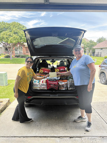 Carla (DASF) with Lorraine Wilson presenting $1,350 to DASF.